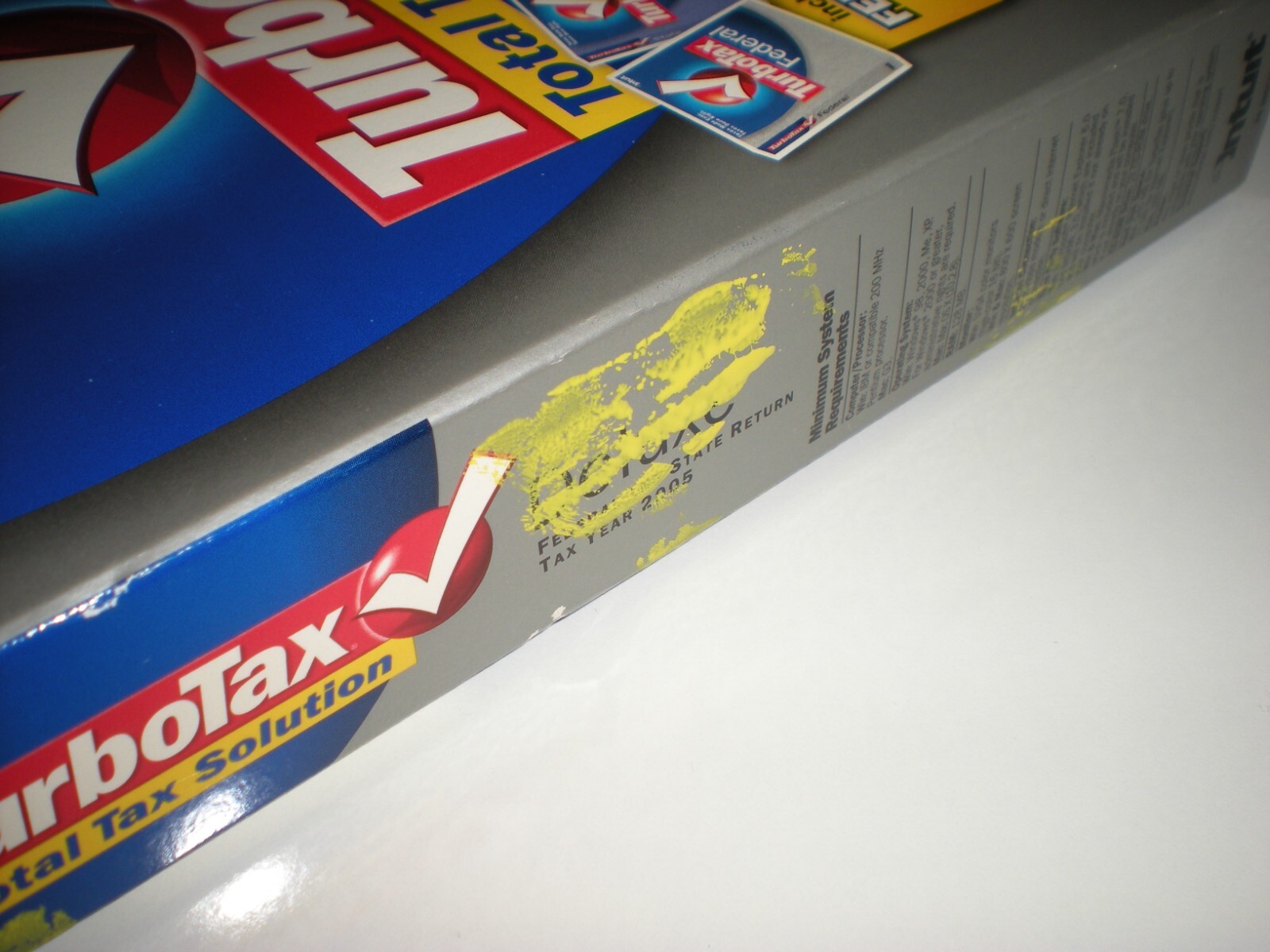 Turbotax 2005 Deluxe + state. New in box. Genuine but blemished package.