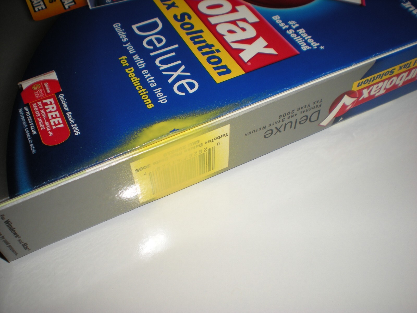 Turbotax 2005 Deluxe + state. New in box. Genuine but blemished package.